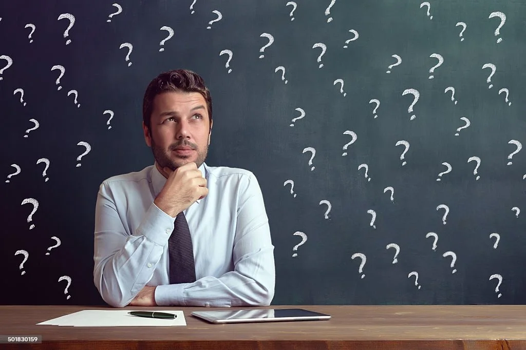 man with question marks
