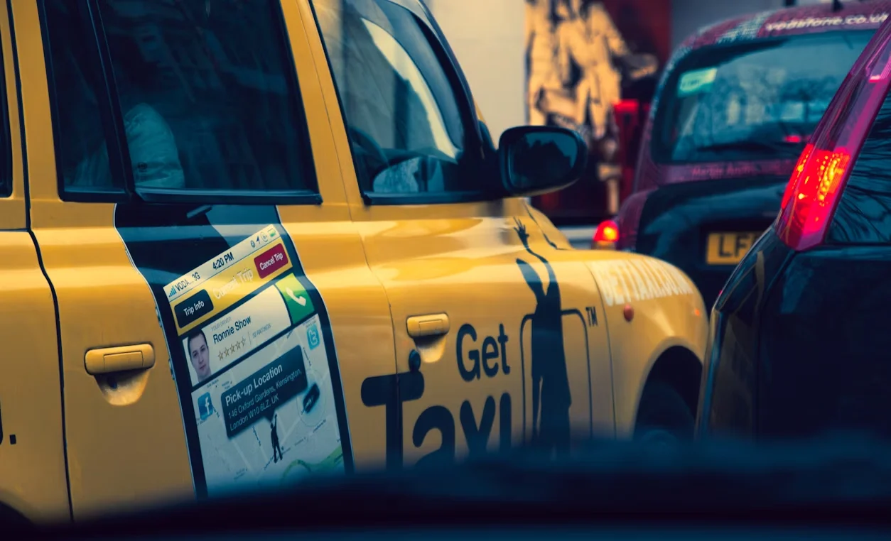taxi with app picture on door (manchester taxi firms)